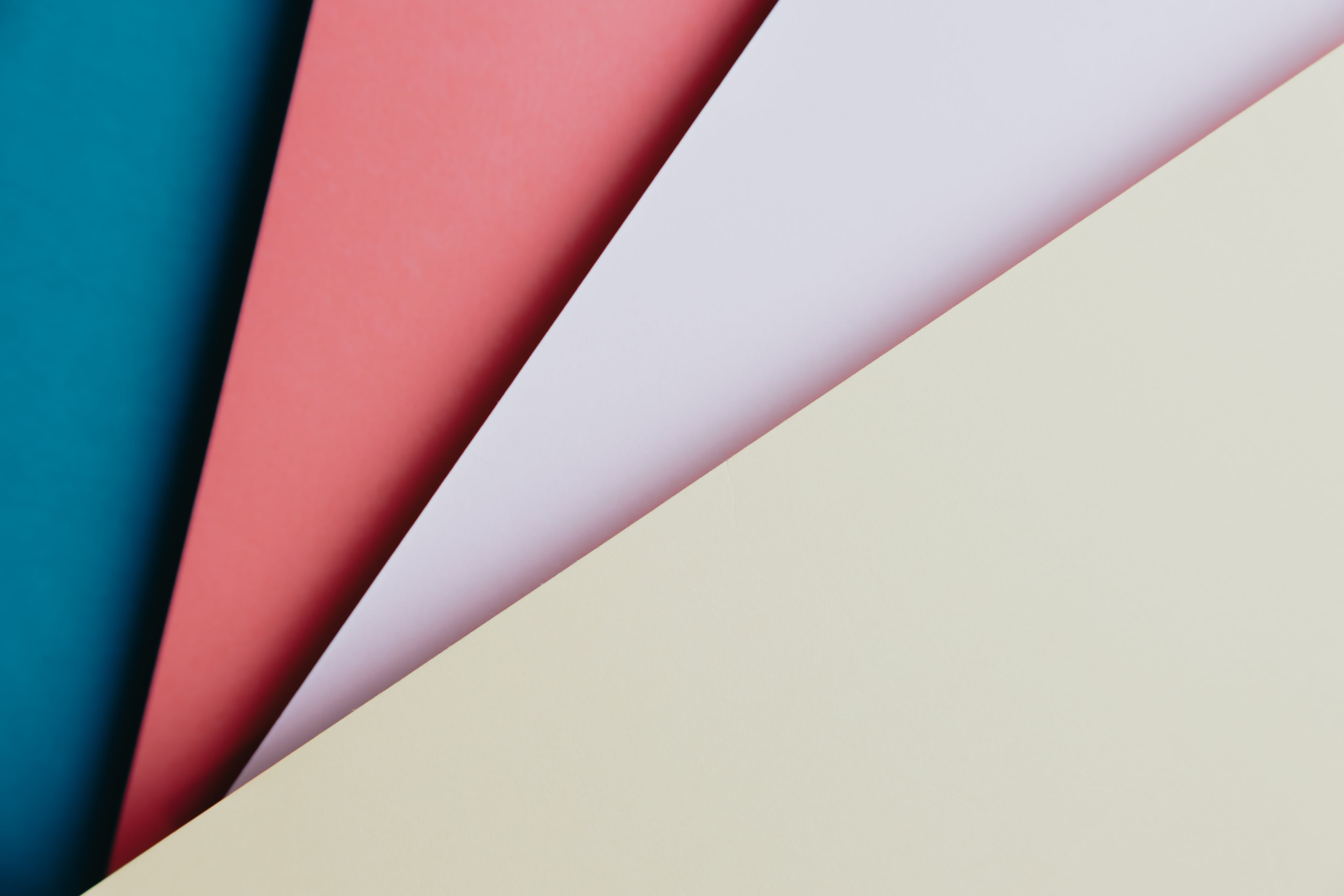 blue, red, pink, and yellow paper fanned out